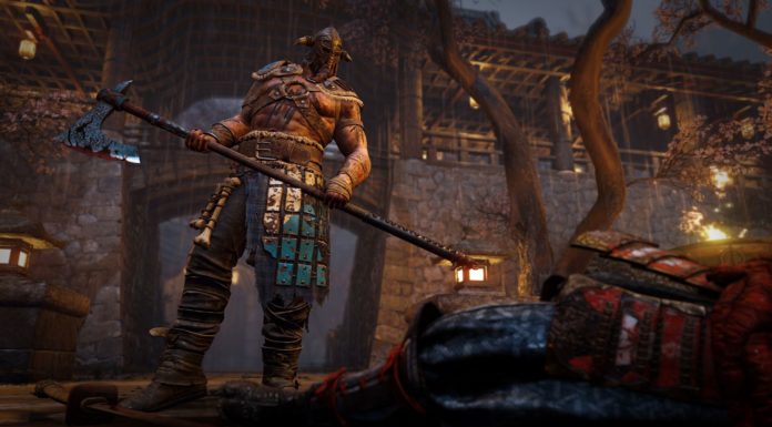 Un viking armé d'une hache devant un cadavre - For Honor gratuit