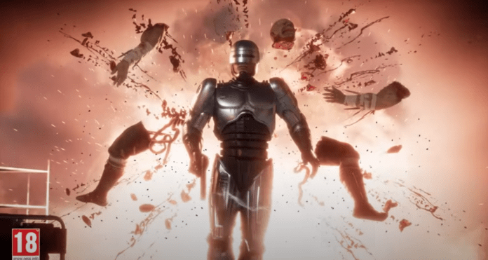 Une fatality de RoboCop dans Mortal Kombat 11: Aftermath ou l'adversaire éclate en morceaux derrière-lui