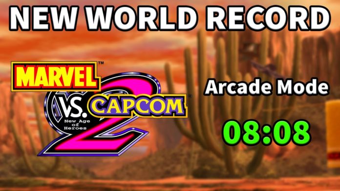 Le logo de Marvel vs. Capcom 2 avec à droite le record du monde de 8:08 et au dessus le titre en anglais « New world record »