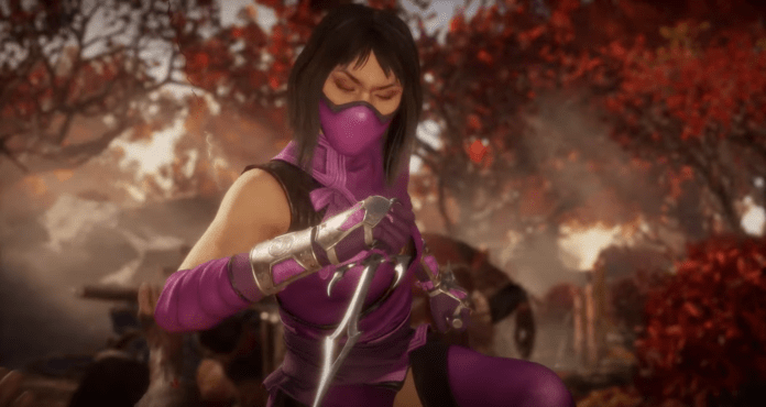 Le personnage de Mortal Kombat 11 Mileena dans une forêt qui tient un saï dans la main droite